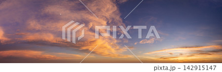 Amazing sunset skyscape. Evening sky with bright colorful orange and yellow clouds Amazing sunset skyscape. Evening sky with bright colorful orange and yellow clouds 142915147