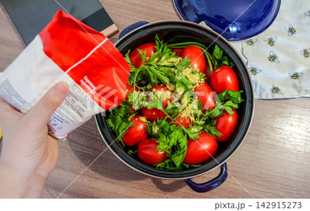 Adding mustard powder to tomatoes for homemade pickling and autumn food preservation Adding mustard powder to tomatoes for homemade pickling and autumn food preservation 142915273