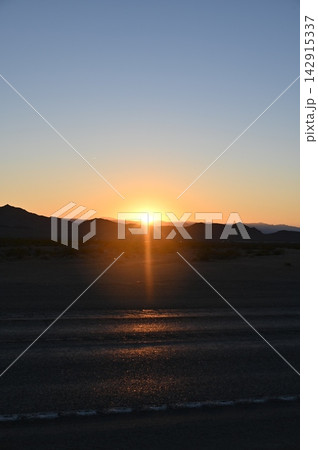 Desert Sunset Over Mountain Horizon in Nevada 142915337
