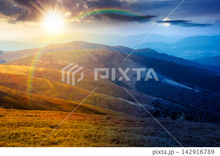 Carpathian mountain landscape in late summer. day meet night. sun and moon over scenic view of Transcarpathia region from the Great Summit. colorful alpine blueberry field on Polonyna Play hill Carpathian mountain landscape in late summer. day meet night. sun and moon over scenic view of Transcarpathia region from the Great Summit. colorful alpine blueberry field on Polonyna Play hill 142916789