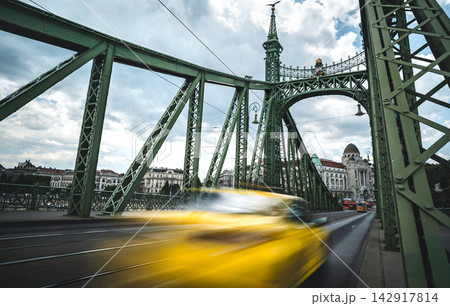 Blurred Rushing Yellow Taxi Moving Fast Along Bridge 142917814