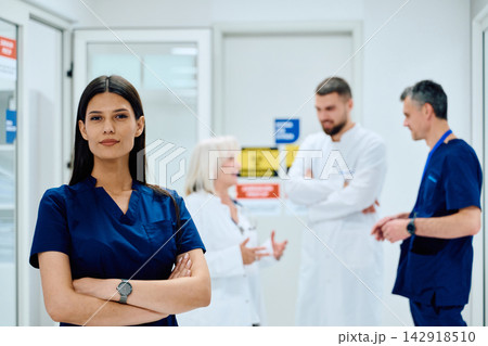 Healthcare professionals collaborate in a modern medical facility discussing patient care strategies Healthcare professionals collaborate in a modern medical facility discussing patient care strategies 142918510