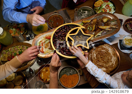 Family Sharing Dates at Ramadan Iftar Dinner With Traditional Middle Eastern Dishes and Togetherness 142918679