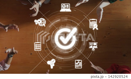 Collaboration and Innovation Concept with Hands, Digital Icons, and Checkmark Symbol on Wooden Table Underneath Bright Light. Raster Collaboration and Innovation Concept with Hands, Digital Icons, and Checkmark Symbol on Wooden Table Underneath Bright Light. Raster 142920524
