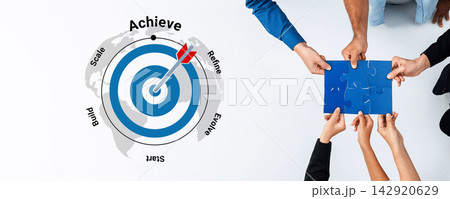 Collaborative Efforts in Business Strategy Development with Target Achievement Concept and Hands Holding Puzzle Piece on White Background Gantry 142920629