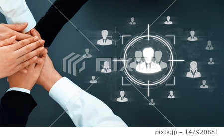 A dynamic visual representation of teamwork, showcasing hands coming together above digital icons of people, symbolizing collaboration and professional unity in a modern work environment. Sigmoid 142920881