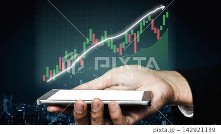 Hand Holding Smartphone with Growing Financial Graph and Stock Market Trends Representing Business Success and Investment Opportunities in the Digital Age Copula 142921139