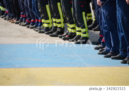 Firefighters And Emergency Responders Standing In Line Wearing Uniforms And Reflective Boots At Ceremony 142921521