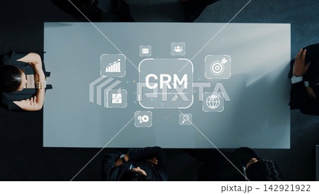 Collaborative Business Meeting Focused on Customer Relationship Management with Visual Technology in Modern Office Setting. Raster 142921922