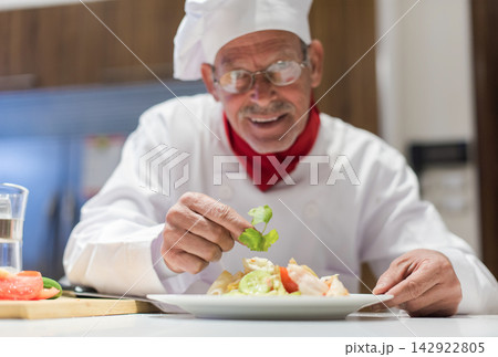 Middle Eastern chef prepares iftar dinner for modern family at home during Ramadan and Eid celebration 142922805