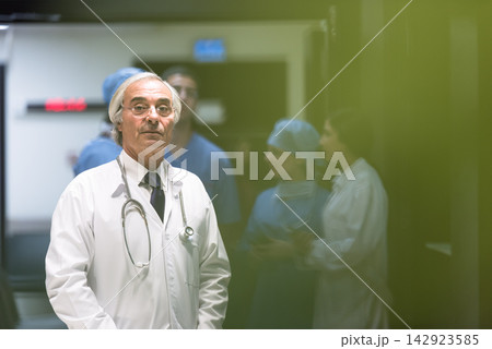 Senior ophthalmologist leading surgical team at a modern Middle Eastern eye hospital clinic in Egypt 142923585