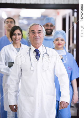 Senior doctor leading an eye hospital surgical team at a modern Middle Eastern clinic in Egypt Senior doctor leading an eye hospital surgical team at a modern Middle Eastern clinic in Egypt 142923608