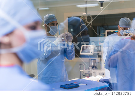 Modern Middle Eastern eye hospital surgery team conducting an operation and briefing in a small clinic in Egypt 142923783