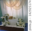 Elegant white and gold Malay wedding dais decorated with hydrangeas and sheer drapes 142925174