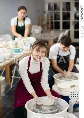 Woman working with pottery wheel Woman working with pottery wheel 142925971