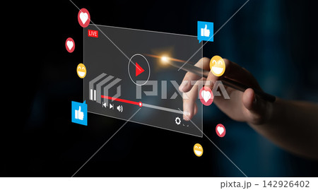 Hand Interacting with Virtual Media Player Interface Displaying Social Media Icons and Live Streaming Elements for Digital Content Engagement Ledger Hand Interacting with Virtual Media Player Interface Displaying Social Media Icons and Live Streaming Elements for Digital Content Engagement Ledger 142926402
