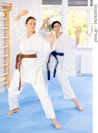 Two women training karate techniques in studio 142926558