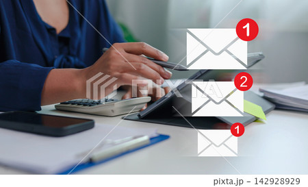 Email notification and electronic mail message concept with businesswoman using tablet. Email notification and electronic mail message concept with businesswoman using tablet. 142928929