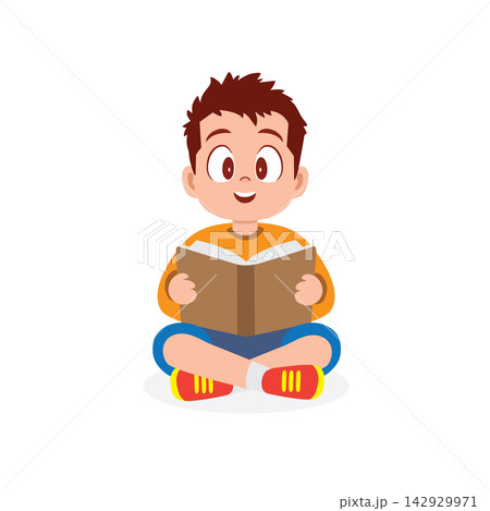 a cheerful young boy sitting cross legged while engrossed in a book a cheerful young boy sitting cross legged while engrossed in a book 142929971