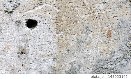 Textured Concrete Wall with a Hole and Weathered Details Textured Concrete Wall with a Hole and Weathered Details 142933143