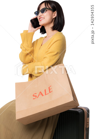 Happy asian woman talking phone holding paper bag discussing artificial intelligence chatbot shopping assistant with joyful emotional expression near luggage on transparency background Happy asian woman talking phone holding paper bag discussing artificial intelligence chatbot shopping assistant with joyful emotional expression near luggage on transparency background 142934355