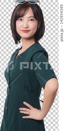 Confident modern young asian woman standing with hand on hip representing artificial intelligence chatbot developer smiling warmly against transparency background studio setup 142934389