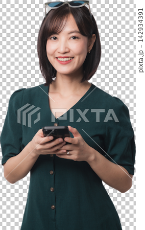 Happy asian woman holding smartphone using artificial intelligence chatbot app with joyful expression isolated on transparency background for mobile communication technology context 142934391