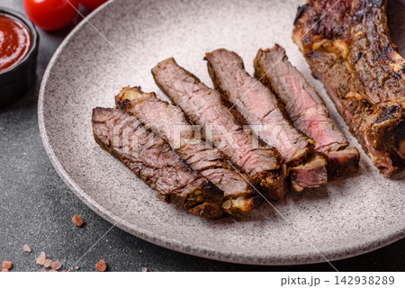 Grilled beef Tomahawk steak seasoned with salt and spices. Tomahawk steak 142938289