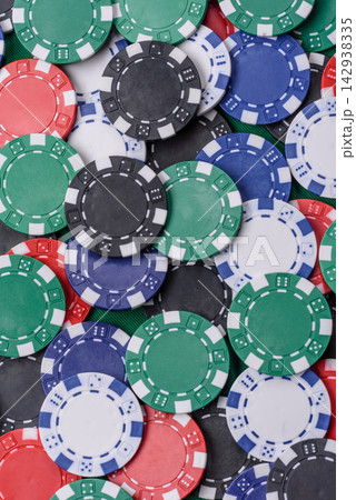Multi colored gaming chips for betting in casino games. Betting chips 142938335
