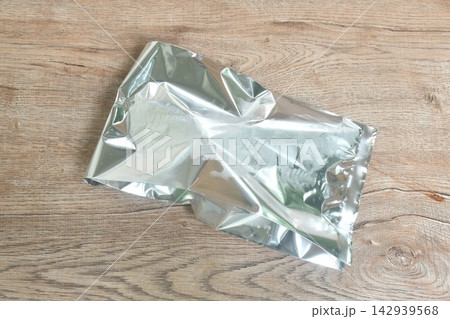 aluminum package foil for maintain temperature of ice cream or snack arranging on table aluminum package foil for maintain temperature of ice cream or snack arranging on table 142939568