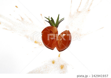 A squashed splattered and crushed broken fresh tomato with seeds A squashed splattered and crushed broken fresh tomato with seeds 142941937