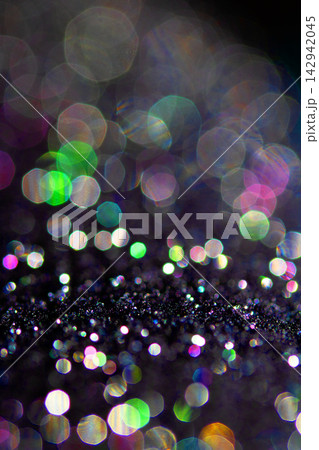 Bokeh sparkly festive black gothic glitter style background sexy fishnet tights Bokeh sparkly festive black gothic glitter style background sexy fishnet tights 142942045
