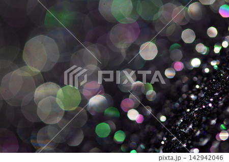 Bokeh sparkly festive black gothic glitter style background sexy fishnet tights Bokeh sparkly festive black gothic glitter style background sexy fishnet tights 142942046