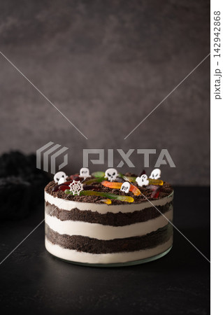 Halloween dessert graveyard Dirt cake on dark background 142942868