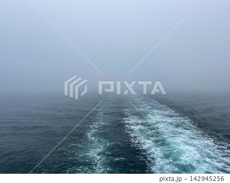 Boat Water Wake Trail on Ocean in Heavy Fog Boat Water Wake Trail on Ocean in Heavy Fog 142945256