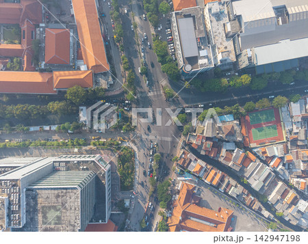 Aerial Morning Surabaya Urban District with Streets and Rooftops Aerial Morning Surabaya Urban District with Streets and Rooftops 142947198