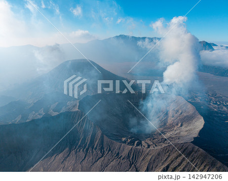 Mount Bromo rise beneath a clear blue sky 142947206