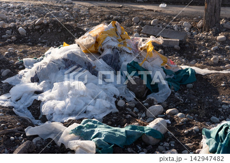 Pile of Plastic Waste on Rocky Ground Pile of Plastic Waste on Rocky Ground 142947482