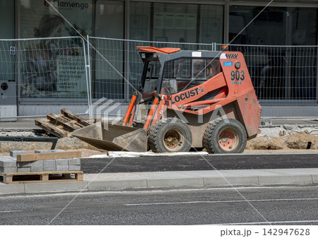 Nitra, Slovakia - May 27, 2024: LOCUST 903 skid-steer loader at urban construction site 142947628