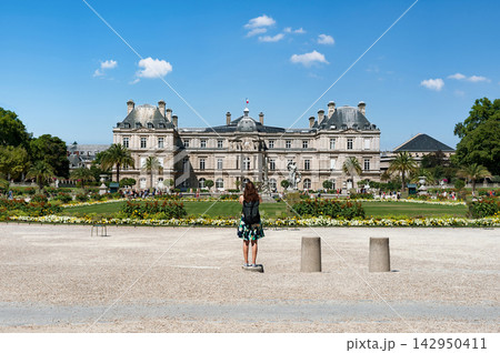 Woman on skateboard in front of Luxembourg Palace in Paris, France 142950411