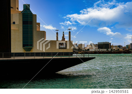 Museum of Islamic Art in Doha, Qatar with city skyline and blue sky 142950581