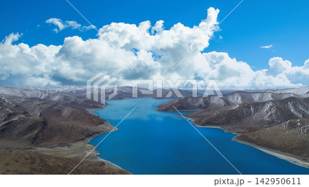 Panoramic View of a High Altitude Blue Lake Surrounded by Snow Capped Mountains in Tibet Panoramic View of a High Altitude Blue Lake Surrounded by Snow Capped Mountains in Tibet 142950611