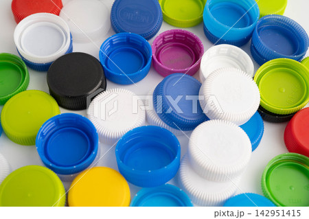 Colorful plastic bottle caps pile. Colorful plastic bottle caps pile. 142951415