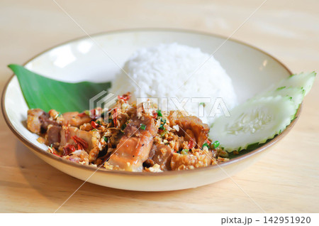 stir fried pork or deep fried pork , fried pork or crispy pork and rice or belly of pork stir fried pork or deep fried pork , fried pork or crispy pork and rice or belly of pork 142951920