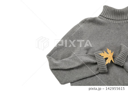 Fall clothing. Cozy gray turtleneck sweater is paired with autumn leaves, PNG 142955615