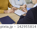 Senior couple signing contract with financial advisor during office consultation 142955814