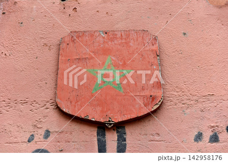 Traditional Moroccan flag painted on a wooden shield in Marrakesh Traditional Moroccan flag painted on a wooden shield in Marrakesh 142958176