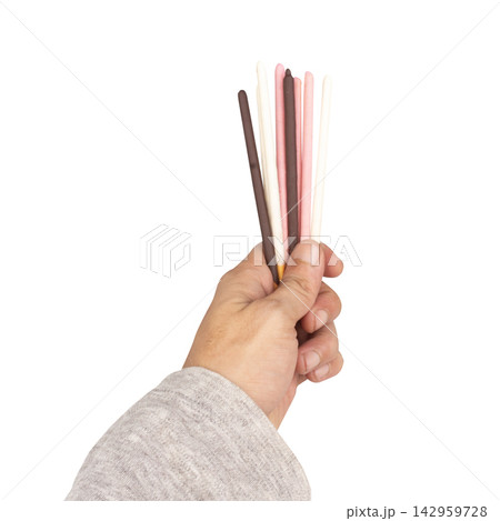 White pink chocolate coated biscuit sticks isolated on white background 142959728