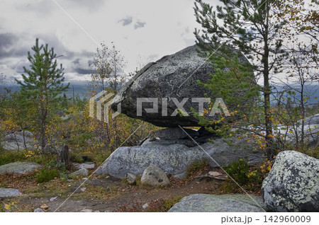 Massive seid rock in the autumn forest 142960009