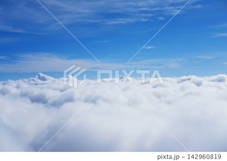Beautiful Aerial view fluffy cloud and sky in heaven from window of airplane Beautiful Aerial view fluffy cloud and sky in heaven from window of airplane 142960819